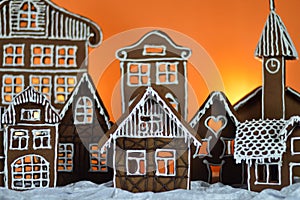 Home made gingerbread village orange background