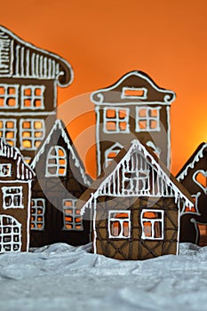 Home made gingerbread village with orange background