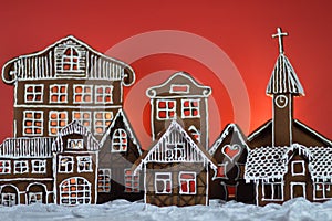 Home made gingerbread village with red background