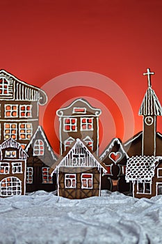 Home made gingerbread village with red background