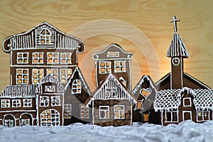 Home made gingerbread village wooden background