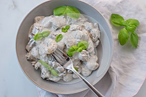 Home made gnocchi with mushrooms and arugula