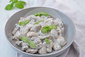 Home made gnocchi with mushrooms and arugula