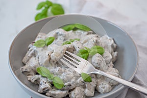 Home made gnocchi with mushrooms and arugula