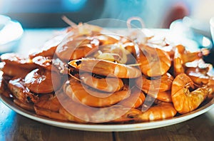 home made Isolated prepared orange shrimp on background table on kitchen, closeup of fresh prawn products in restaurant, shellfish