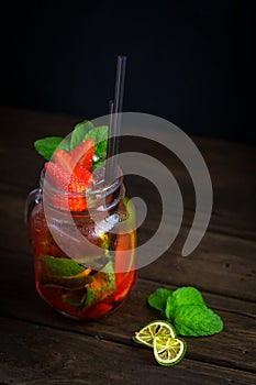 Home-made Mojito with strawberries in a glass jar