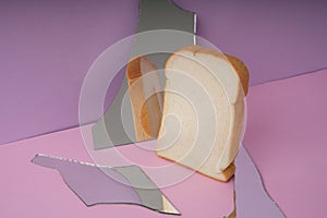 Home made organic sliced bread with broken mirror in pink purple room