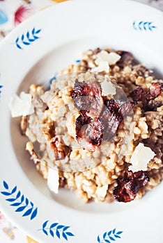 Home made orzotto with common morels and crunchy bacon