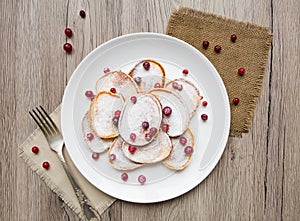 Home made pancakes with cranberries and sugar powder. Top view, flat lay, view from above