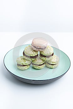 Home-made pistachio macaroons on plate