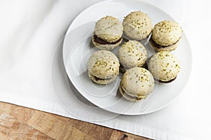 Home-made pistachio macaroons on white plate