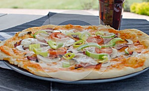 Home made pizza with soda