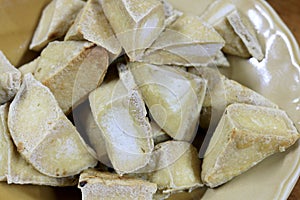 Home made of snack and dessert, Chinese Traditional Deep Fried Tofu or Fried Bean Curd Served in dish on wooden table