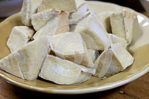 Home made of snack and dessert, Chinese Traditional Deep Fried Tofu or Fried Bean Curd Served in dish on wooden table