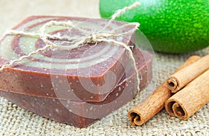 Home-made soap with avocado and cinnamon sticks