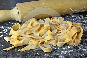 Home Made Tagliatelle On a Black Surface