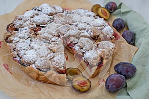 Home made vanilla almond tarte with plums with crumble