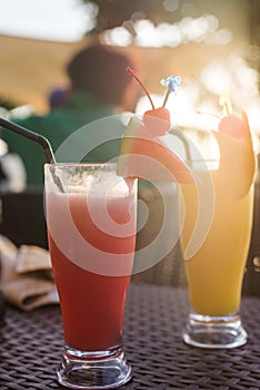 Home made watermelon and pineapple smoothie decorated with slices of watermelon, strawberries, bananas and whole pine