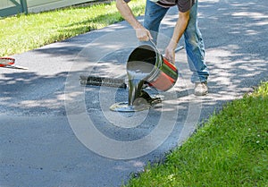 Home maintenance. Do it yourself driveway resealing.