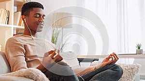 Home meditation audio relax man earphones sofa