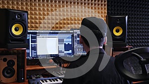 Home music studio. Sound engineer mixing and mastering at sound music studio. Digital audio workstation. Home recording studio.