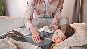 Home nap parent care woman covering plaid girl