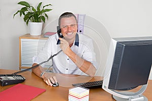 a Home office businessman talking on phone