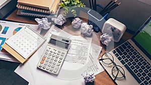 Home Office Desk Concept. Laptop, and calculator for accountant or bookkeeper plan annual budget report and tax. Computer,