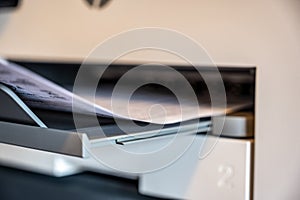 narrow focus on printer tray with paper