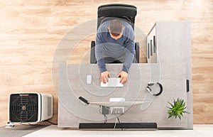 Home Office Worker in Front of Computer Top View