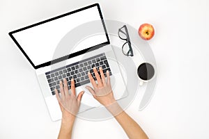 Home office workspace mockup. Laptop with blank screen, hands and accessories on white