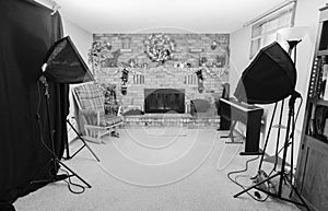 Home photography studio with fireplace and mantle decorated for