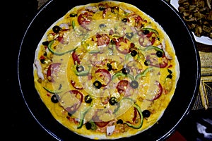 Home pizza making, hamburger pizza with extra yellow cheese