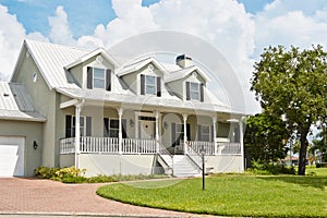 Home with Porch and Dormer Windows