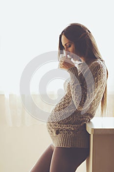 Home portrait of pregnant woman