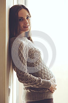 Home portrait of pregnant woman