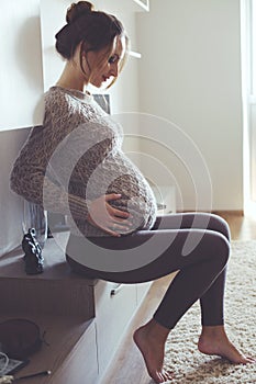 Home portrait of pregnant woman