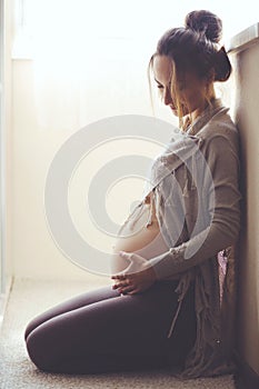 Home portrait of pregnant woman