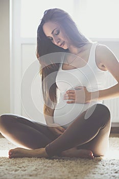 Home portrait of pregnant woman