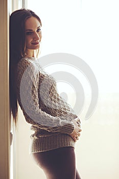 Home portrait of pregnant woman