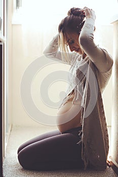 Home portrait of pregnant woman