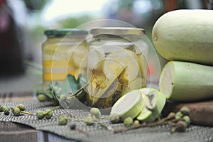 Home preservation with sliced marinated zucchini, outdoor