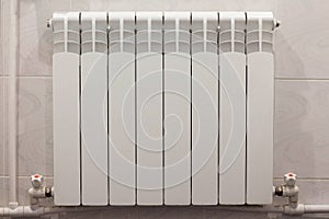 Home radiator heater on white wall