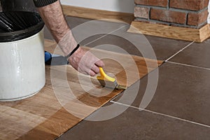 Home renovation parquet. Varnish paintbrush strokes on a wooden parquet