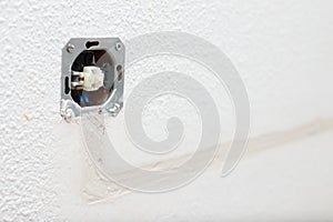 Home renovation, plastering plug wires in the wall, new made electricity wire covered by cement, house rapair