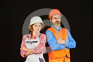 Home renovation. Woman builder hard hat. Man engineer or architect. Couple renovating house. Gender equality