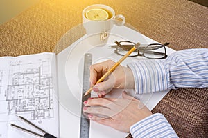 Workplace of the architect, designer with drawings, samples of decorative materials