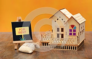 Home for Rent Sign with House miniature