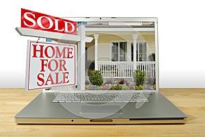 Home for Sale Sign on Laptop photo
