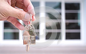 Home sales agents are giving home keys. Rent a house, buy and Sell concept